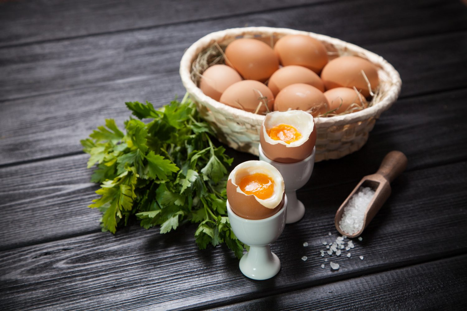 Fresh boiled eggs on dark background