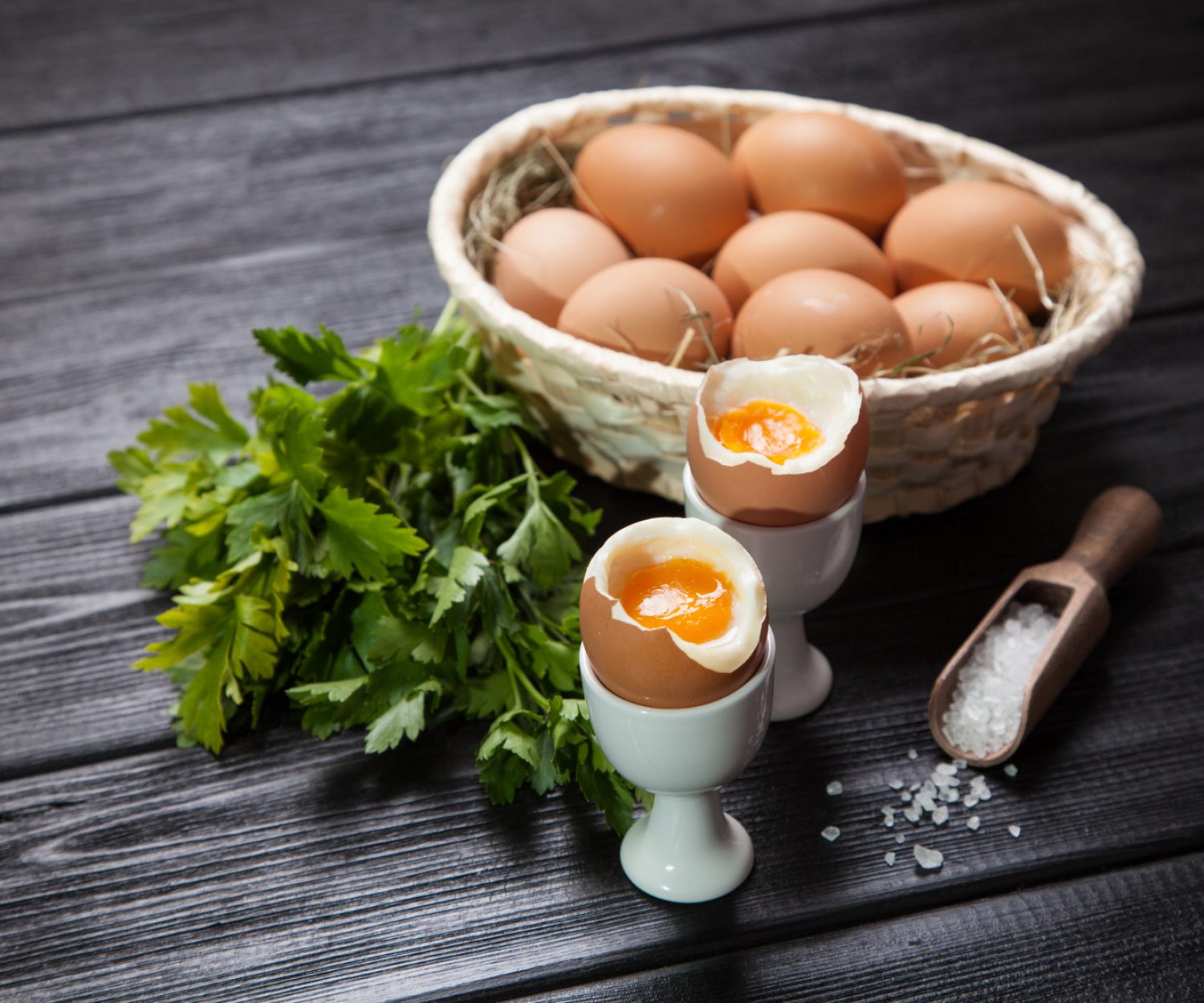 Fresh boiled eggs on dark background