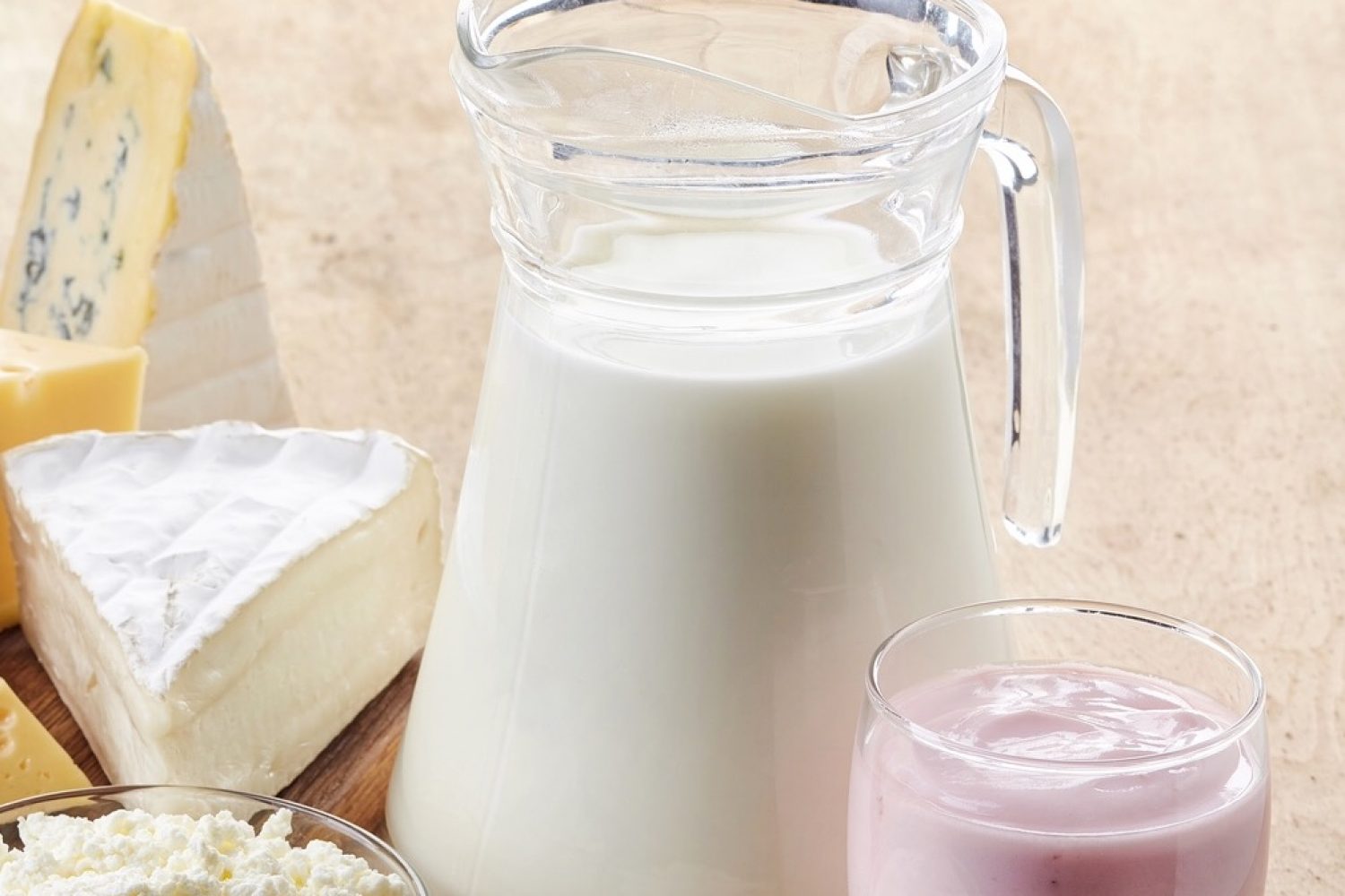 Various fresh dairy products on wooden background