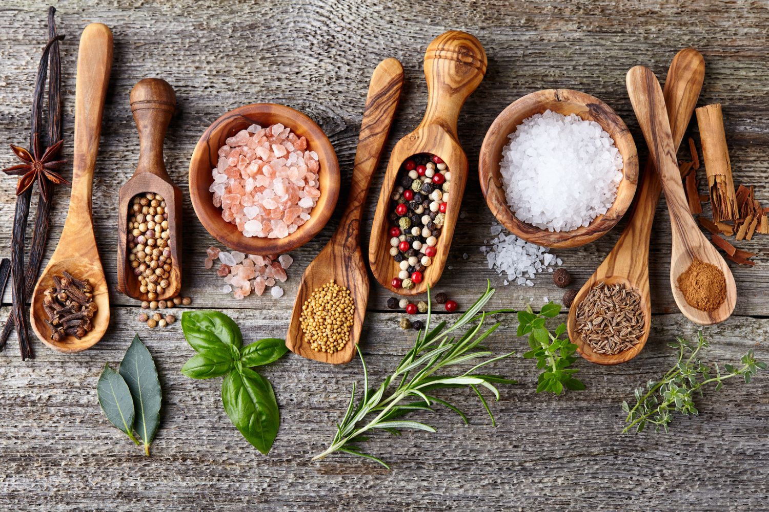 Spices and herbs on a wooden background